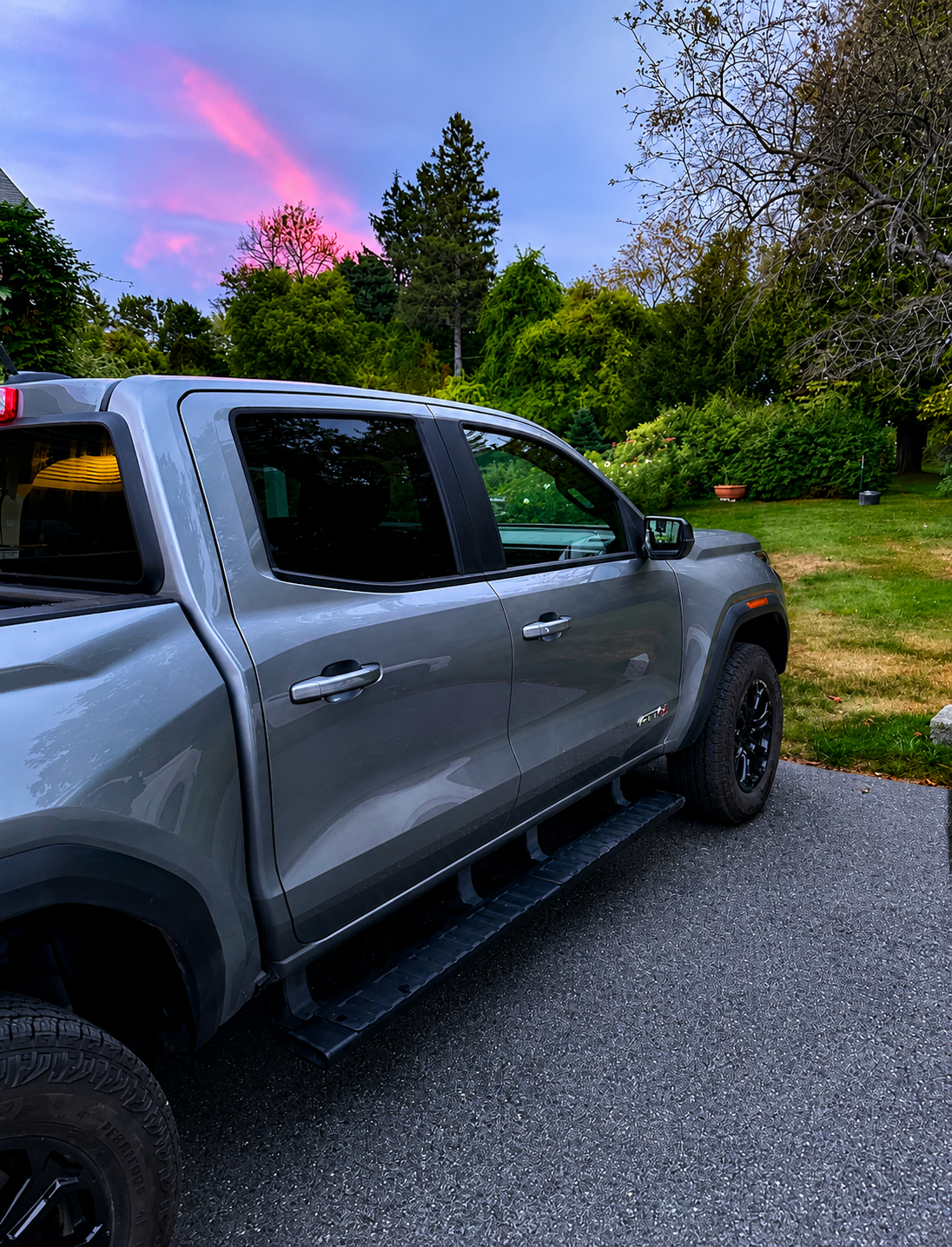 Clean gray pickup truck parked outdoors after an exterior detail.